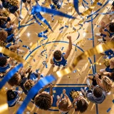 A bright pep-rally echo chant with blue-and-gold hooks, marching snare, and easy claps that invite instant participation.